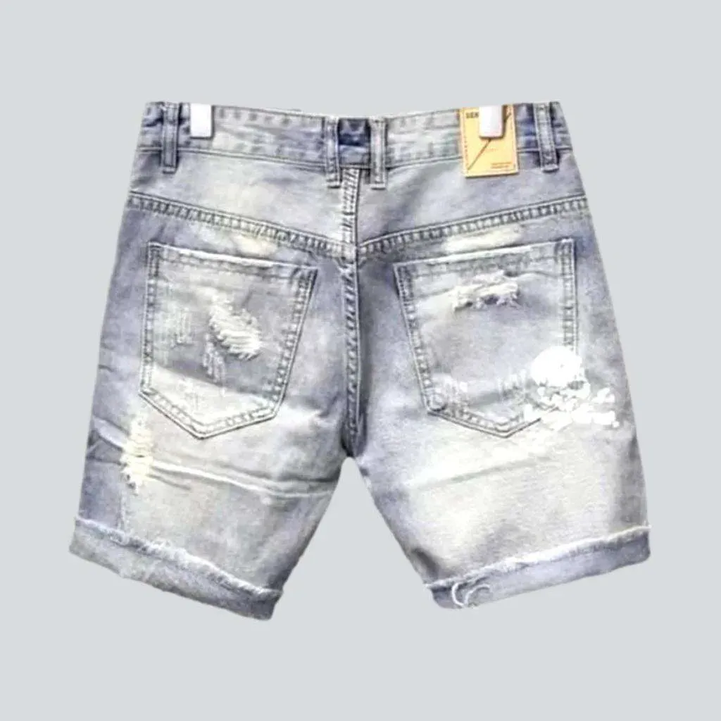 Skull print ripped denim shorts