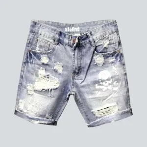 Skull print ripped denim shorts